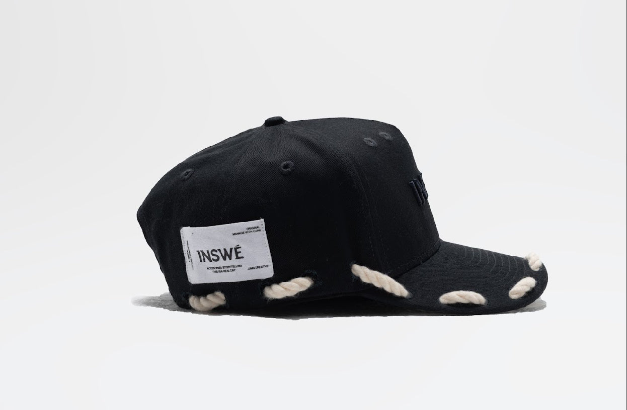 Black rope trucker cap