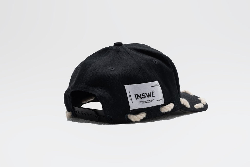 Black rope trucker cap